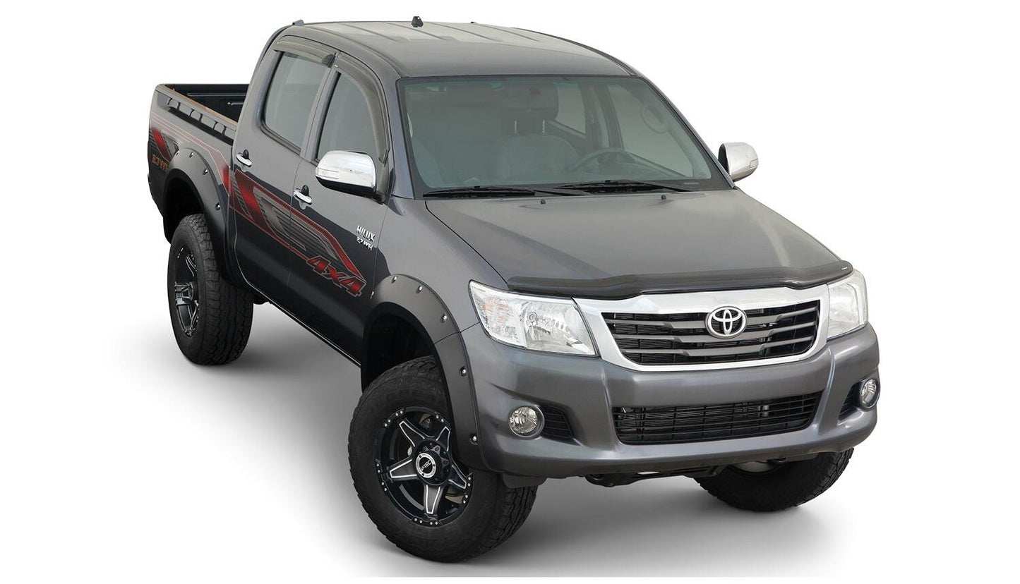 Black Pocket/Rivet Style Smooth Finish 4-Piece Fender Flare Set For 2011-2013 Toyota Hilux Bushwacker