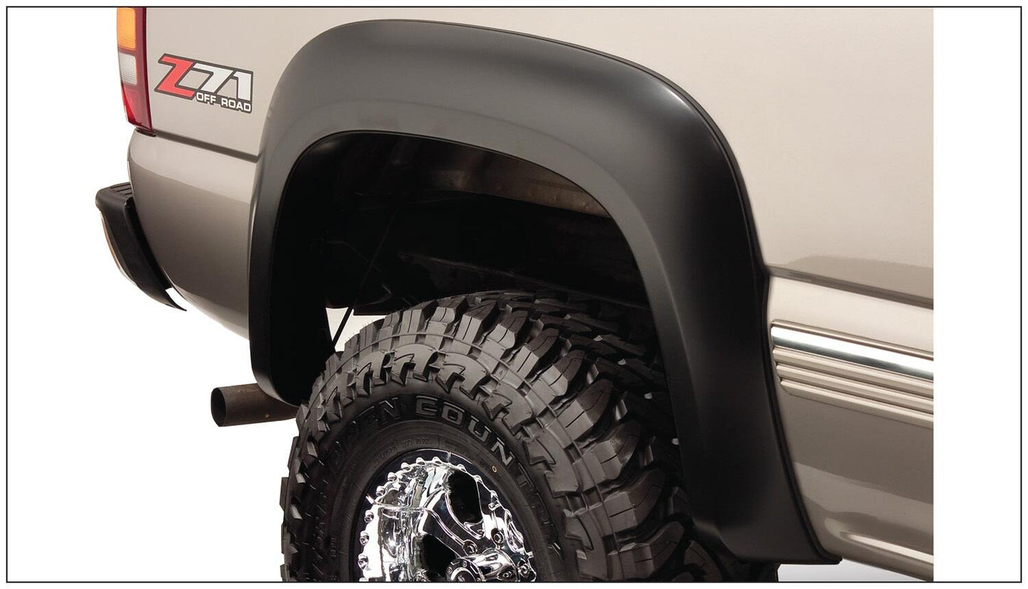 Black Extendafender Style Smooth Finish 4-Piece Fender Flare Set With Extended Coverage For 99-07 Silverado/Sierra Trucks (Check Application Guide) Bushwacker