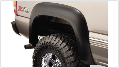Black Extendafender Style Smooth Finish 4-Piece Fender Flare Set With Extended Coverage For 99-07 Silverado/Sierra Trucks (Check Application Guide) Bushwacker